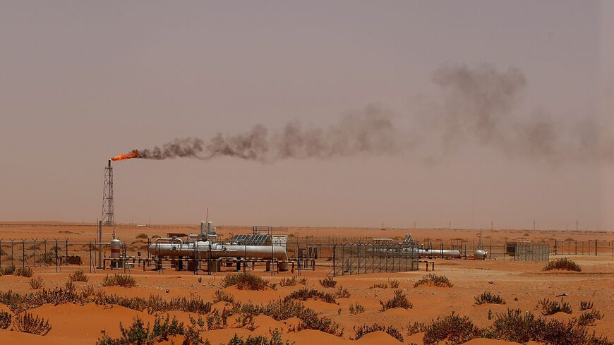 A flame from a Saudi Aramco oil installion known as "Pump 3" is seen in the desert near the oil-rich area of Khouris, 160 kms east of the Saudi capital Riyadh, on June 23, 2008.  