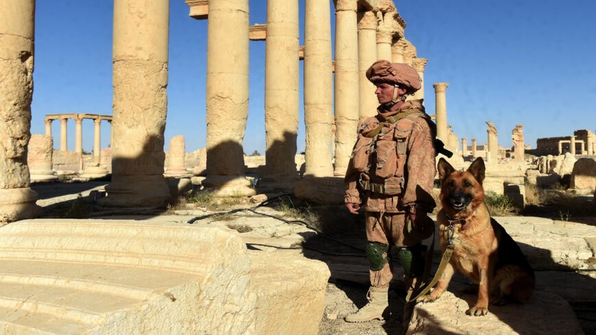 Russian army soldiers patrol the ancient Syrian city of Palmyra on May 5, 2016. 