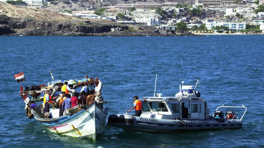An undated picture shows Yemeni coast guards checking a small boat with refugees arriving from Somalia to the Yemeni port city Aden. 