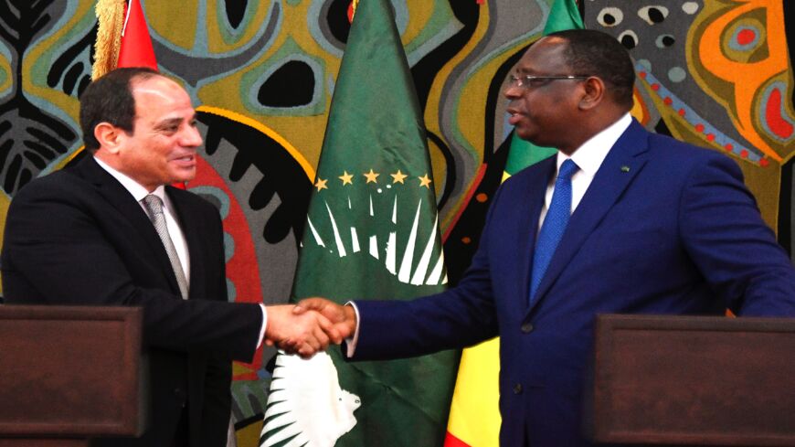 Egypt's President and current Chairperson of the African Union, Abdel Fattah al-Sisi (L), takes part in a joint press conference with Senegalese President Macky Sall at the Presidential Palace in Dakar for an official visit on April 12, 2019.