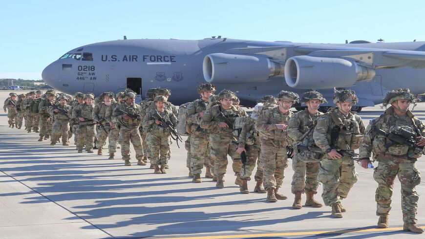 This handout picture released by the US Army shows US Army Paratroopers at Pope Army Airfield in North Carolina, Jan. 1, 2020. Paratroopers from 2nd Battalion, 504th Parachute Infantry Regiment, 1st Brigade Combat Team, 82nd Airborne Division were activated and deployed to the US Central Command area of operations in Iraq.