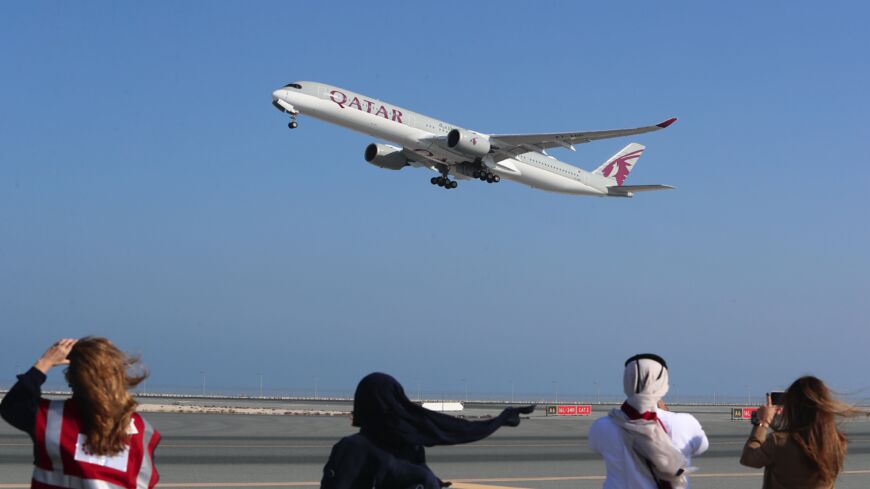 A Qatar Airways Airbus A350 airplane takes off from Hamad International Airport.