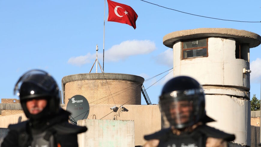 Iraqi riot police protect the Turkish embassy in Baghdad on Feb. 18, 2021 after calls on social media to gather outside the Turkish embassy to protest Turkey's vows to invade the northwestern enclave of Sinjar. 