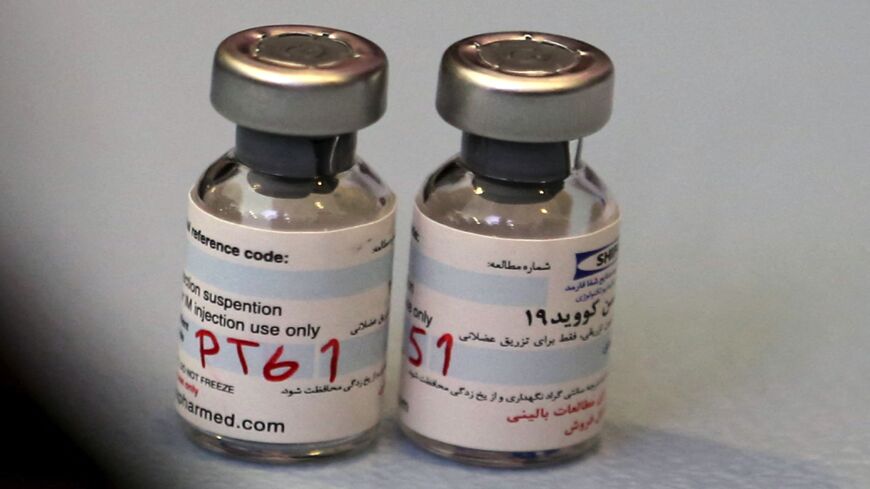 A picture shows vials of the locally made Iranian COVID-19 vaccine during the start of the second phase of trials in the capital, Tehran, on March 15, 2021.