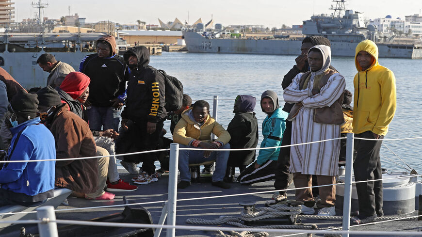 Migrants arrive at a naval base in Tripoli, after the coast guard intercepted an inflatable boat carrying 138 Europe-bound migrants off its west coast, Libya, March 31, 2021.