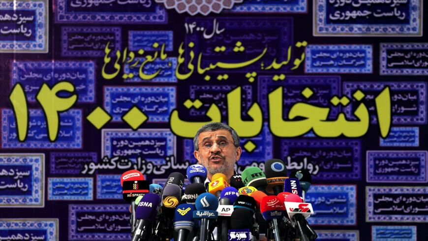 Iran's former President Mahmoud Ahmadinejad addresses reporters at the Interior Ministry headquarters.
