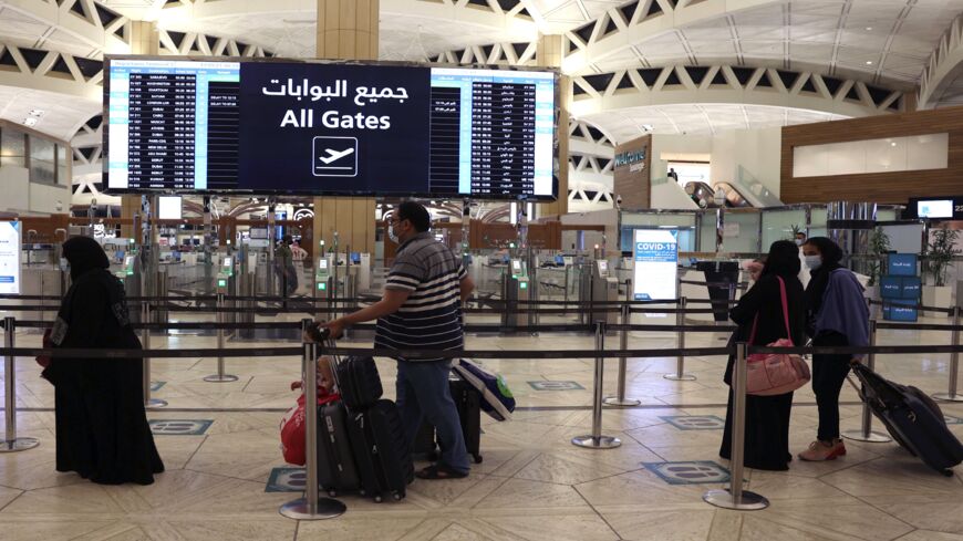 Saudi passengers arrive at King Khaled International airport in the capital, Riyadh, on May 17, 2021.
