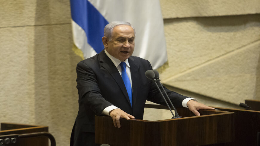 Israeli Prime Minister Benjamin Netanyahu speaks before parliament votes to approve the new government, Jerusalem, June 13, 2021.