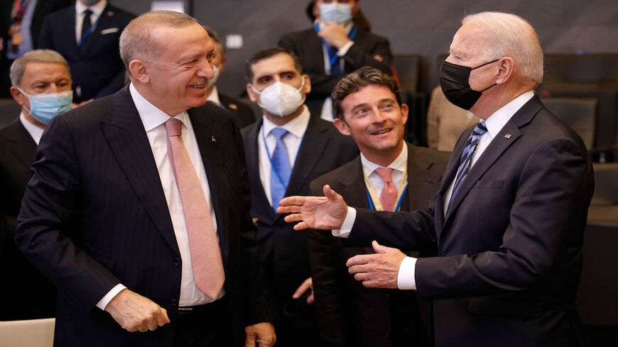 US President Joe Biden (R) speaks with Turkey's President Recep Tayyip Erdogan prior to a plenary session of a NATO summit at NATO headquarters, Brussels, Belgium, June 14, 2021.