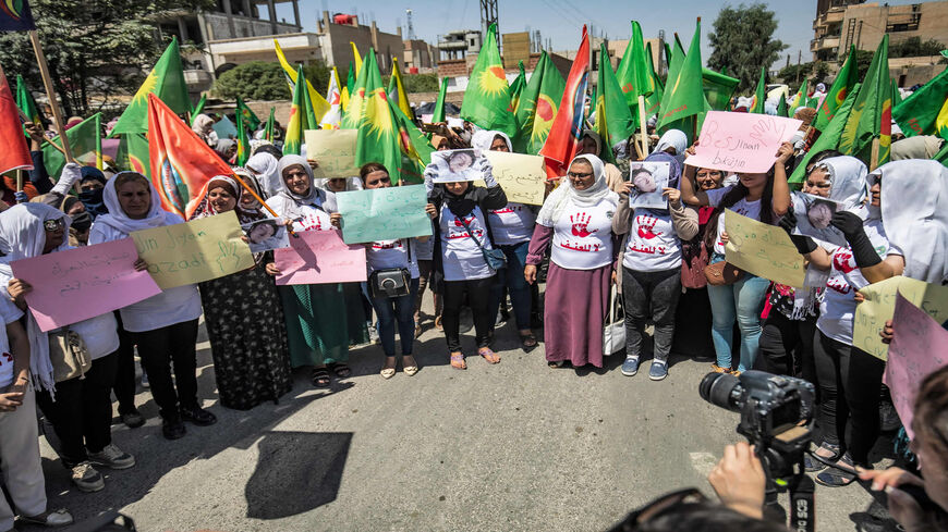 Syrian Kurdish women attend a protest against honor killings, Hasakah, Syria, July 6, 2021.