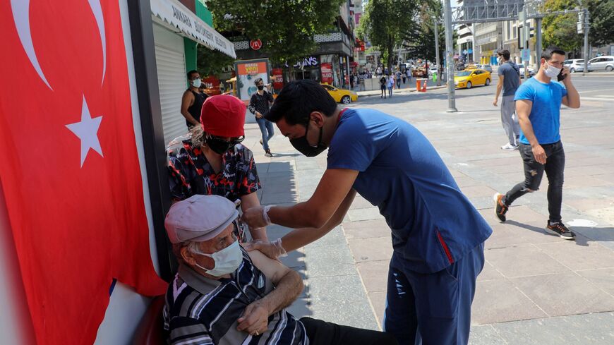 Coronavirus vaccine given in Ankara square