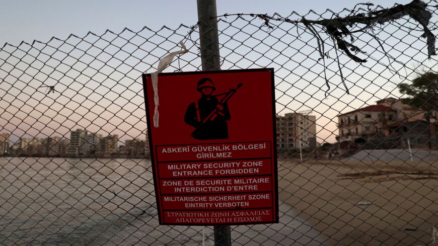 A Turkish army sign is pictured in the fenced-off area of Varosha in Famagusta town in the self-proclaimed Turkish Republic of Northern Cyprus (TRNC) of the divided Mediterranean island of Cyprus, on July 16, 2021. 