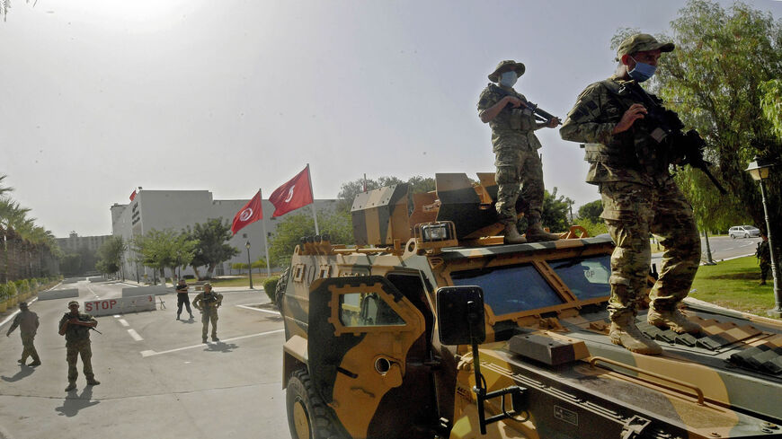 Tunisian military forces guard the area around the parliament building, following protests in reaction to a move by the president last night to suspend the parliament and dismiss the prime minister, Tunis, Tunisia, July 26, 2021.