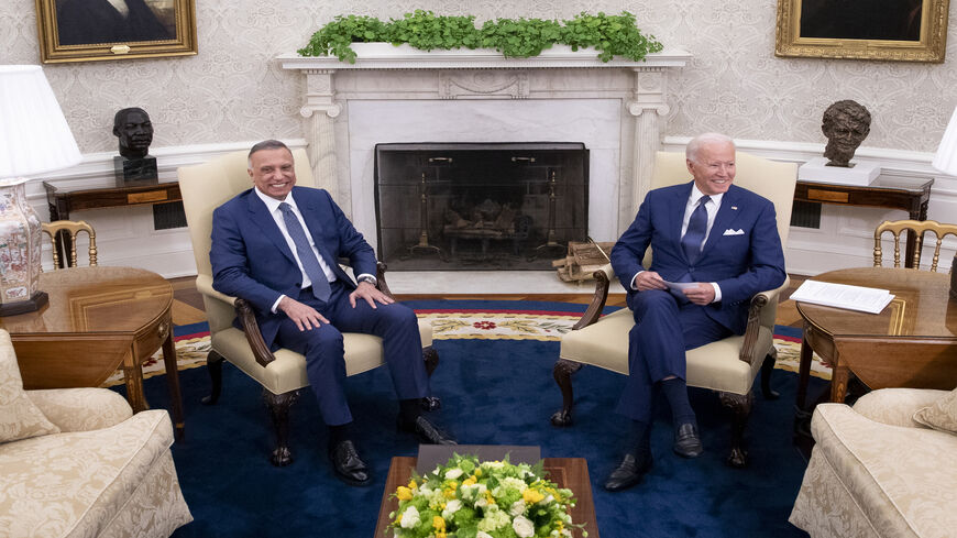 US President Joe Biden (R) hosts Iraqi Prime Minister Mustafa al-Kadhimi for a bilateral meeting in the Oval Office at the White House, Washington, July 26, 2021.