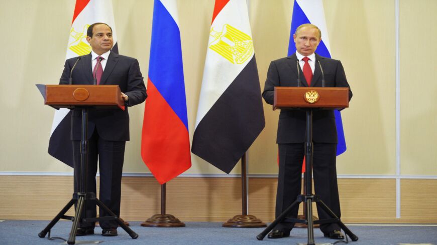 Russian President Vladimir Putin (R) and his Egyptian counterpart Abdel Fattah el-Sisi (L) attend their news conference 