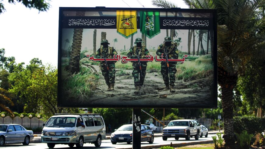 A picture taken on June 20, 2018, shows a propaganda billboard for the pro-Iran Hezbollah Brigades militia.