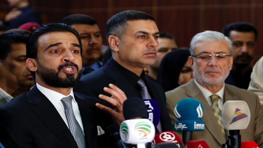 Mohammed al-Halbusi (L), newly elected speaker of the Iraqi parliament, delivers a speech Sept. 18, 2018, following a meeting in Basra.