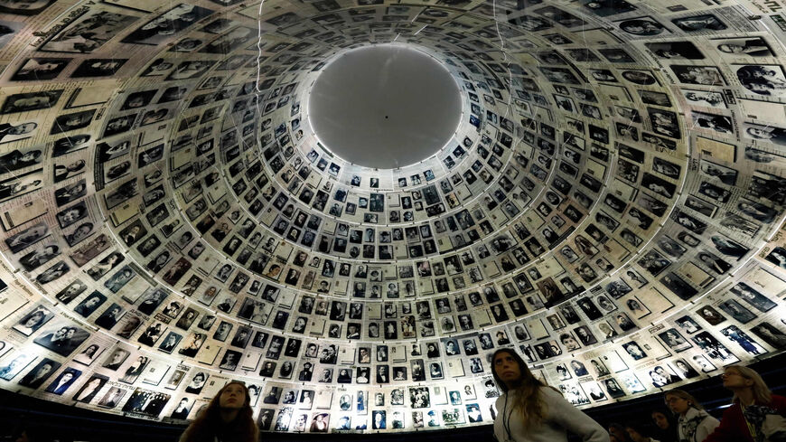 Visitors look at the Hall of Names, a repository for the names of millions of Holocaust victims at the Yad Vashem memorial center, Jerusalem, Jan. 20, 2020.