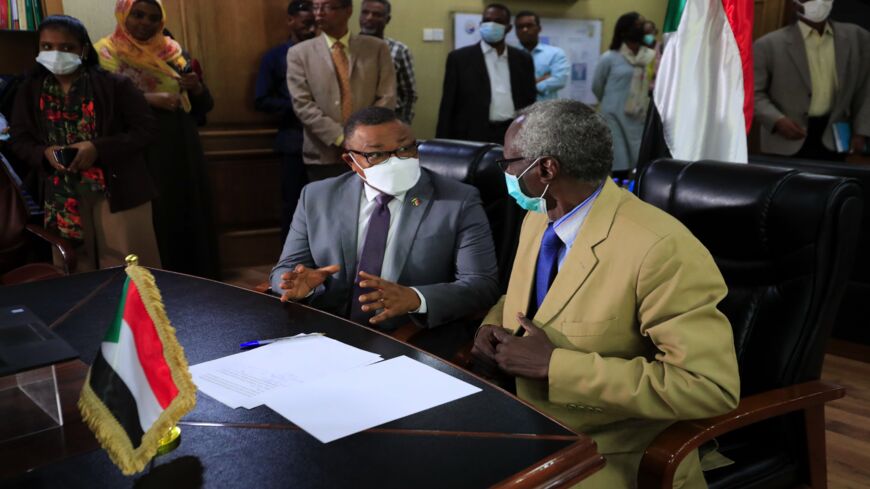 Sudan's Minister of Irrigation and Water Resources Yasser Abbas (R) and Minister for Foreign Affairs Omar Gamar al-Din are pictured during a video conference.