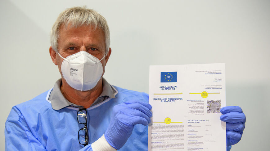 Dr. Christoph Borch shows an example of a digital vaccination pass in the Babelsberg vaccination center in the Metropolishalle following the presentation of the digital vaccination pass at a press conference on May 27, 2021, in Potsdam, Brandenburg, Germany.