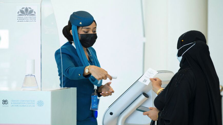 A woman arrives to get vaccinated at the Oman Convention & Exhibition Center in the capital, Muscat, on June 23, 2021.