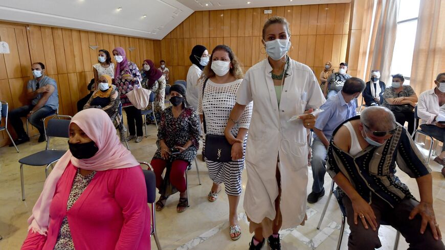 Tunisians wait to be vaccinated