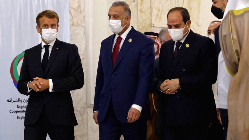 (L to R) French President Emmanuel Macron, Iraq's Prime Minister Mustafa al-Kadhemi, Egypt's President Abdel Fattah al-Sisi and Iranian Foreign Minister Hossein Amir-Abdollahian arrive for a group picture after the meeting in Baghdad on August 28, 2021. (Photo by Ludovic MARIN / POOL / AFP) (Photo by LUDOVIC MARIN/POOL/AFP via Getty Images)