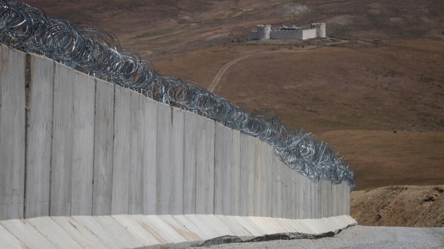 A part of Turkey’s newly completed border wall is seen on the Turkey-Iran border on July 10, 2021, in Caldiran, Turkey.