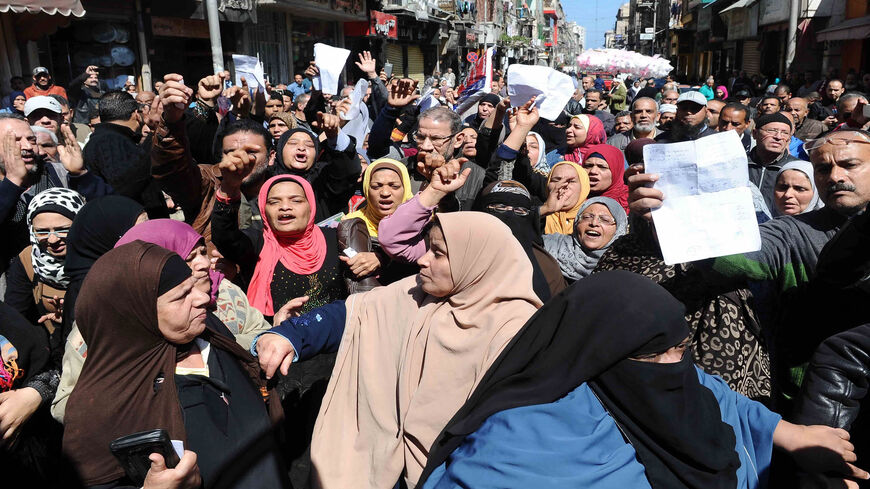 Dozens of Egyptians take part in a demonstration in front of a government office against the decision of the Supply Ministry to limit the distribution of subsidized bread to holders of a new system of digital cards issued by the ministry, downtown Alexandria, Egypt,  March 7, 2017.