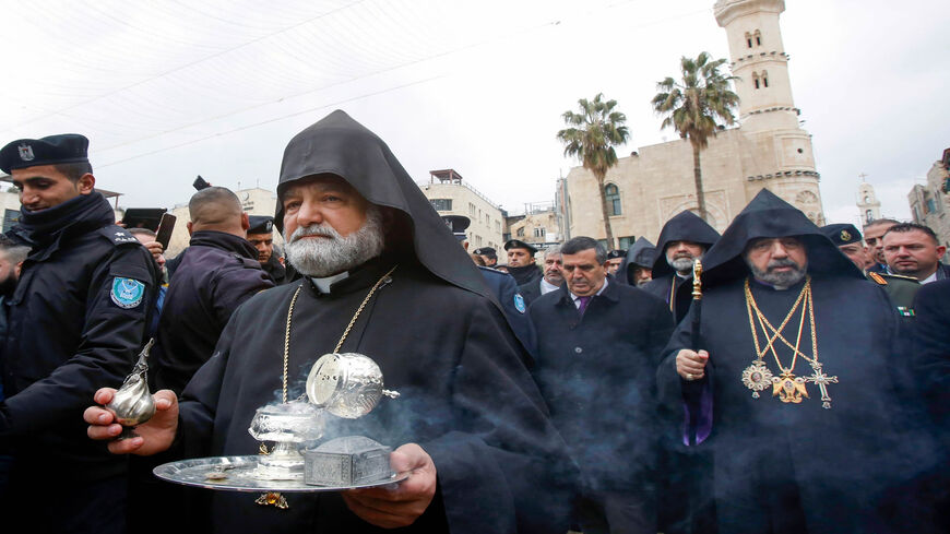 Nourhan Manougian (R), the Armenian patriarch of Jerusalem, makes his way to the Church of the Nativity during the Epiphany celebrations, Bethlehem, West Bank, Jan. 18, 2020.