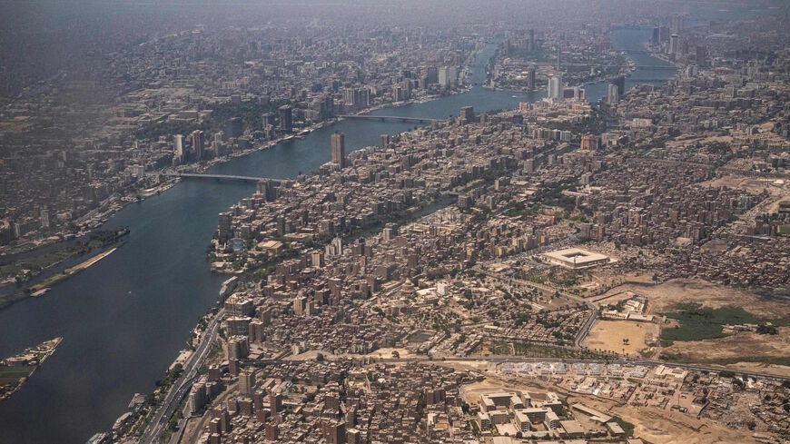 This picture taken on May 14, 2021 shows an aerial view of Egypt's capital Cairo, showing the historic old Cairo district (C) and the Nile river islands of (C to top) Manial al-Roda and Zamalek. 