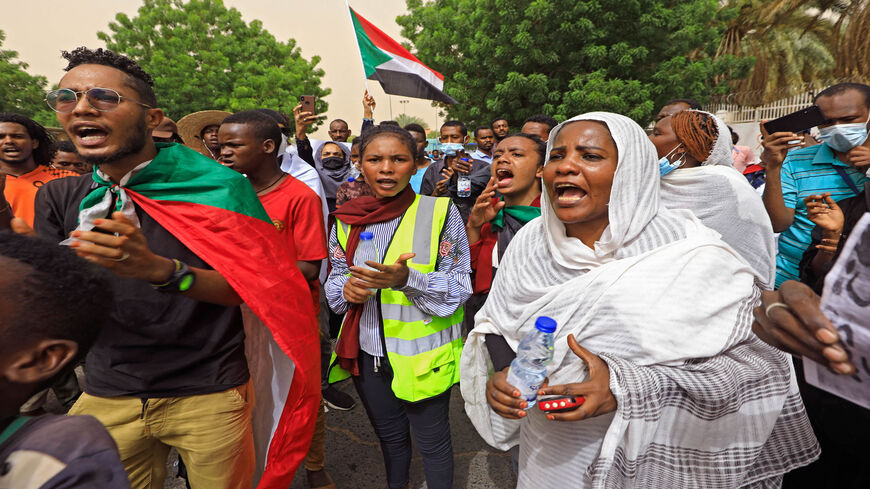 Sudanese protesters shout slogans and carry banners as they march during a demonstration calling for justice for protesters killed during anti-government demonstrations two years ago, Khartoum, Sudan, June 3, 2021.