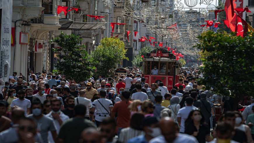 Pedestrians walk on Istiklal Street, the main shopping street in Istanbul, on the fourth day of the Eid-al-Adha holiday on July 23, 2021.