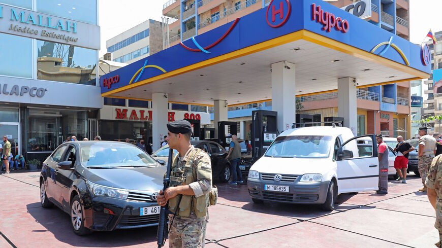 Lebanese soldiers are pictured at a petrol station in the capital Beirut on Aug. 14, 2021, after soldiers were deployed to force several stations to reopen their doors. 