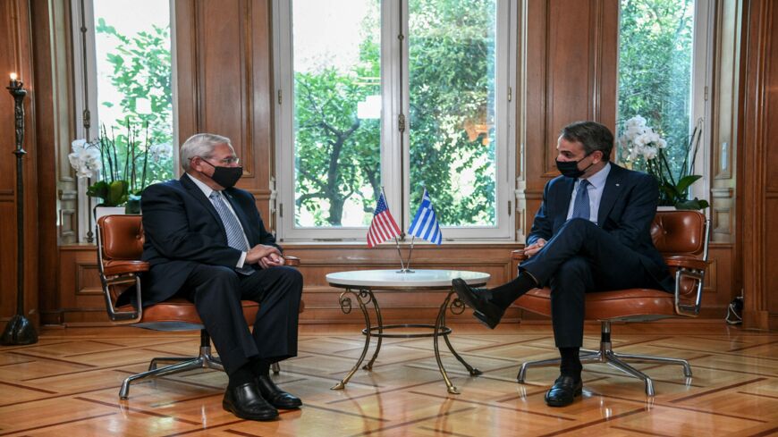 Greek Prime Minister Kyriakos Mitsotakis (R) meets with Chairman of US Senate Foreign Relations Committee Bob Menendez at the Maximos Mansion in Athens, on Aug. 26, 2021. 