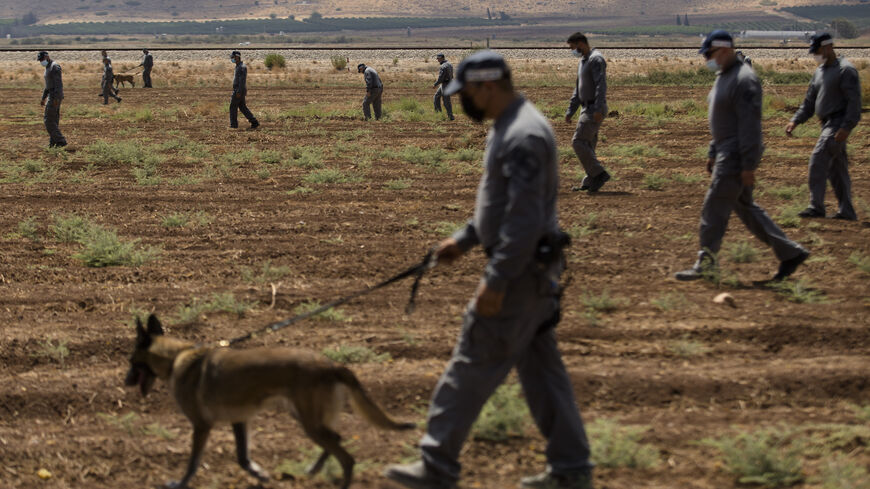 Police officers search as they investigate an area where six Palestinian prisoners managed to escape from Gilboa prison overnight on Sept. 6, 2021 near Kibbutz Beit HaShita in the Gilboa region, Israel. The prisoners, who include Al-Aqsa Martyrs' Brigade leader Zakaria Zubeidi, are believed to have escaped through a tunnel overnight.