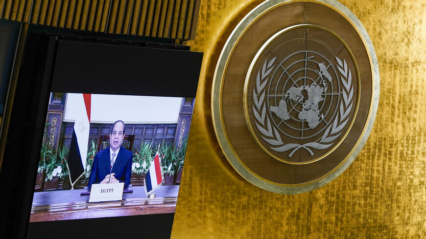 Egyptian President Abdel Fattah Al Sisi is seen on video screens as he addresses the annual gathering in New York City for the 76th session of the United Nations General Assembly (UNGA) on Sept. 21, 2021 in New York City.