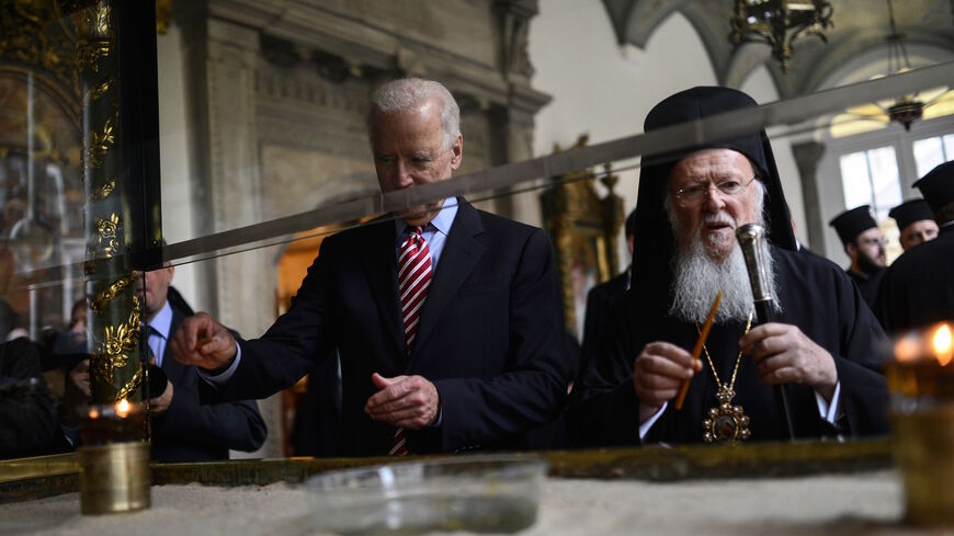 US Vice President Joe Biden (L) and Orthodox Patriarch Bartholomew I light candles during Biden's visit to the Church of St. George on Nov. 23, 2014 in Istanbul. 