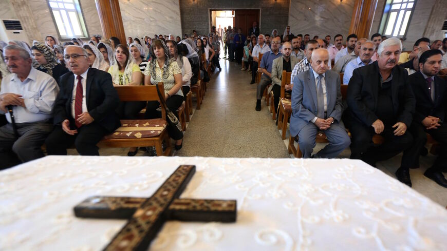 Iraqi Assyrian Christians attend a ceremony with the Holy Synod of the Assyrian Church of the East to elect a new Catholicos-patriarch of the Assyrian Church of the East, at Saint Youhanna church in Arbil, the capital of the autonomous Kurdish region of northern Iraq on Sept. 18, 2015. 
