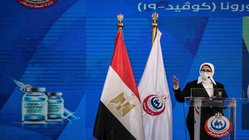 Egyptian Health Minister Hala Zayed gives a press conference in a tent set up outside the Abou Khalifa Hospital, in Ismailia, Egypt, Jan. 24, 2021.