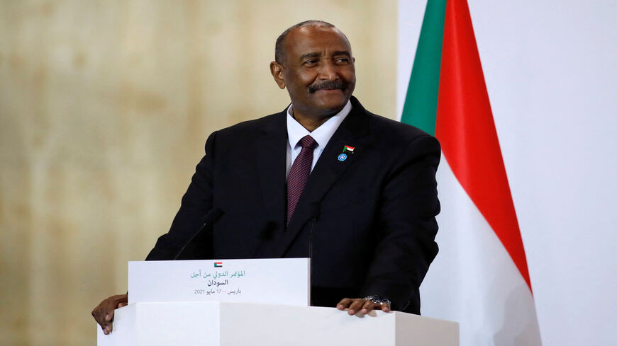 Sudan's Sovereign Council Chief General Abdel Fattah al-Burhan gives a press conference with the French president and Sudanese prime minister during the International Conference in support of Sudan at the temporary Grand Palais in Paris, France, May 17, 2021.