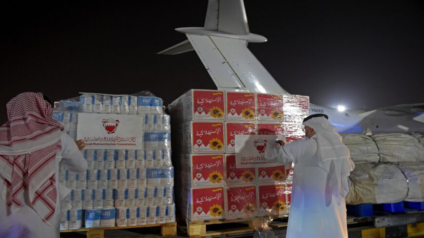 Volunteers label a shipment of humanitarian aid to be sent to Afghanistan at Bahrain International Airport on Muharraq Island, near the capital, Manama, on Sept. 4, 2021.