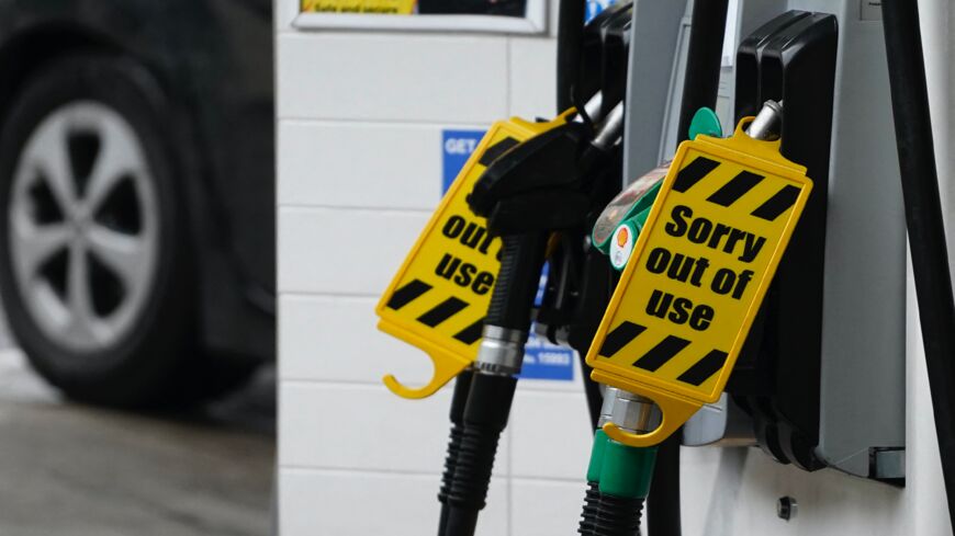 "Out of Use" signs are displayed on the fuel pumps at a filling station in Baker Street, central London, on Oct. 2, 2021.