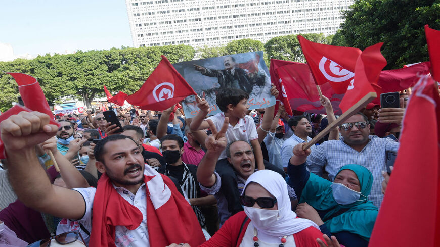 Tunisians chant slogans supporting President Kais Saied during a rally at Habib Bourguiba Avenue, Tunis, Tunisia, Oct. 3, 2021.