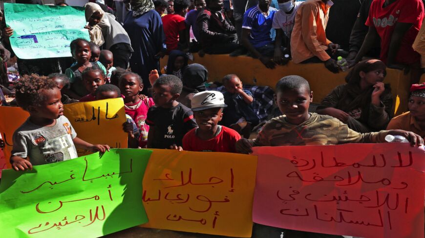 African migrants stage a demonstration outside the headquarters of the UN Refugee Agency in the Siraj area of the Libyan capital, Tripoli.
