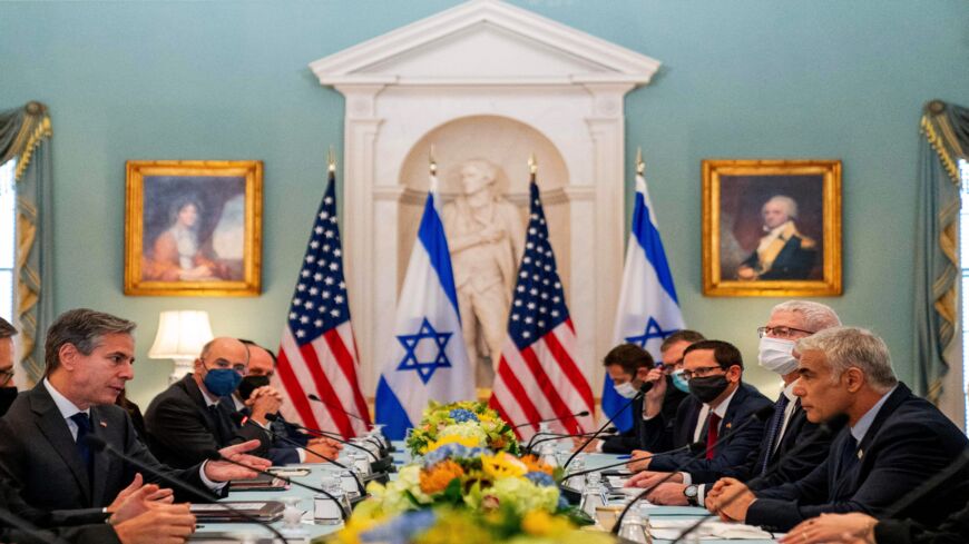 Secretary of State Antony Blinken, left, accompanied by Israeli Foreign Minister Yair Lapid, right, speaks at a bilateral meeting at the State Department in Washington, DC, on Oct. 13, 2021.