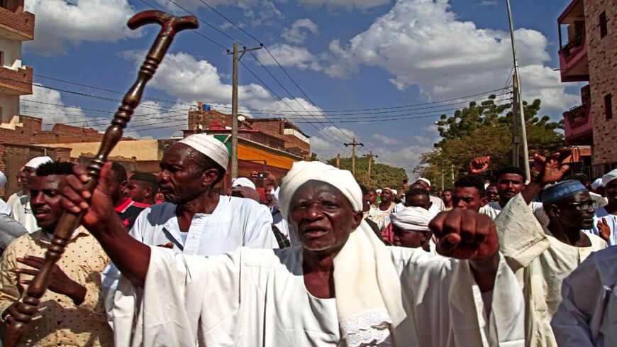 Supporters of the Umma Party, Sudan's largest political party, chant slogans during a protest against a military coup.
