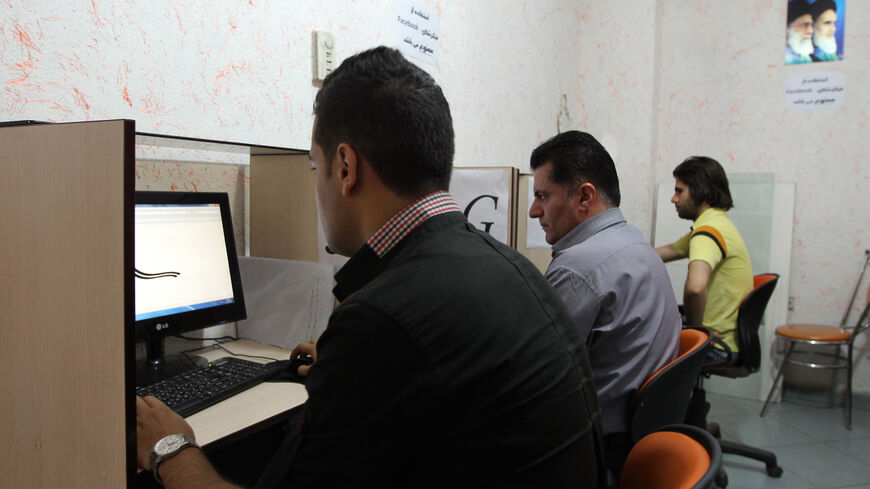 Iranians use internet at a cybercafe in the center of the Iranian capital Tehran on May 14, 2013.