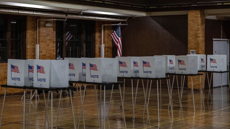 Empty voting booths are seen in Flint, Michigan at the Berston Fieldhouse polling place on Nov. 3, 2020. 