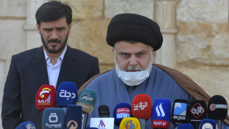 Iraqi cleric Moqtada Sadr delivers a statement in which he backed early elections overseen by the United Nations, in an extremely rare press conference outside his home in Iraq's holy city Najaf, on Feb. 10, 2021. 